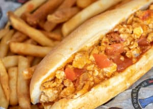 Buffalo Chicken cheesesteak with onions, tomato, hot sauce, and white American cheese. Served on a toasted hoagie with side of ranch and fries