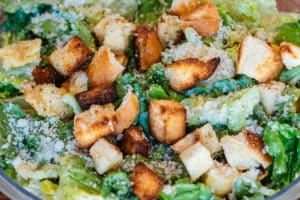Caesar salad with romaine lettuce tossed with caesar, croutons and parmesan cheese. 