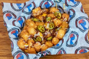 Loaded tater tots with cheddar jack cheese, bacon, and jalapenos