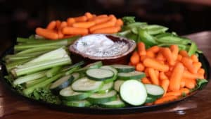 Veggie Catering Tray with Baby carrots, celery, cucumber, and green pepper and a French onion dip