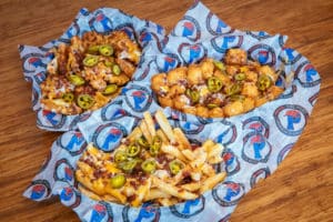 Loaded tater tots with cheese, bacon and jalapenos, loaded fries with cheese, bacon, and jalapenos, and loaded waffle fries with cheese, bacon, and jalapenos