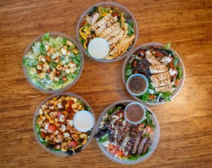Steak Salad, caesar salad, chicken club salad, gluten free caprese salad, and a Southwest Salad with jalapeno ranch dressing
