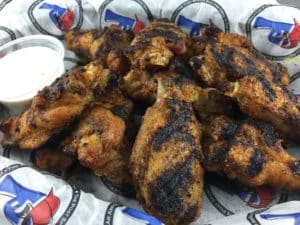 Memphis Wings Appetizer consisting of charbroiled and gently coated in a homemade Memphis-style rub and served with ranch