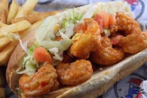 Shrimp Po Boy Sandwich tossed in bang bang sauce. Served on a toasted hoagie with lettuce and tomato