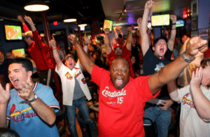 Fans at The Post Sports Bar & Grrill in Maplewood celebrating a St.Louis Cardinals victory