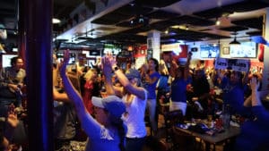 St. Louis Blues Fans at The Post Sports Bar & Grill cheering after a goal against the Bruins