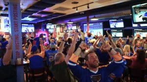 St.Louis Blues fans cheering at The Post Sports Bar & Grill after a goal in the stanley cup finals against the Boston Bruins