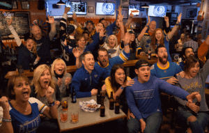 Crowd drinking beers and cheers-ing the St.Louis Blues at The Post Sports Bar & Grill in Maplewood